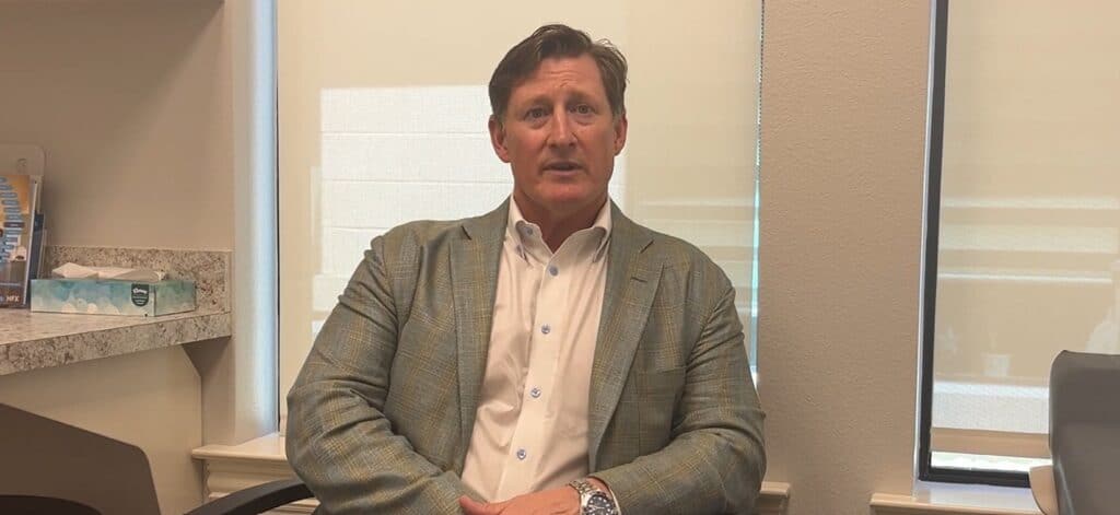 Person sitting in an office chair talking
