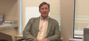 Person sitting in an office chair talking